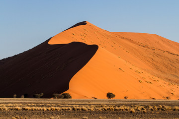 Fototapeta na wymiar The red sand dunes of Sossusvlei in the Namib Nauklft National Park in Namibia
