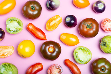 Flat lay top view food background with multicolored assortment of French fresh ripe tomatoes