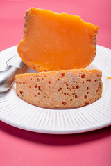 Two pieces of native French aged cheese Mimolette, produced in Lille with greyish curst made by special cheese mites