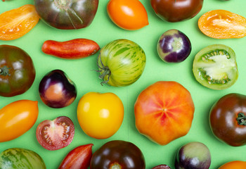 Flat lay top view food background with multicolored assortment of French fresh ripe tomatoes