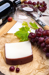 Traditional Spanish cheese, Murcian wine cheese from goat milk with rind washed in red wine, served with fresh ripe grapes