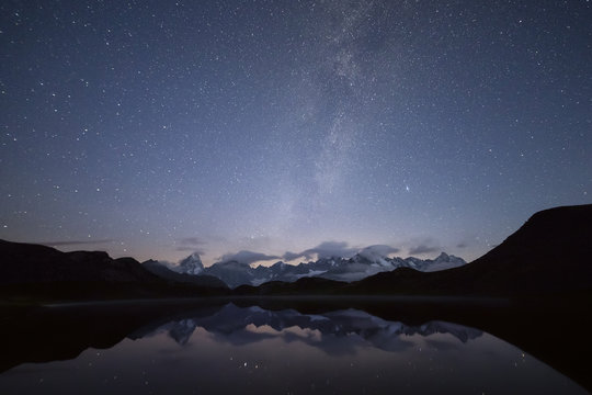 Starry summer sky on Fenetre Lakes and the high peaks Ferret Valley Saint Rh√©my Grand St Bernard Aosta Valley Italy Europe
