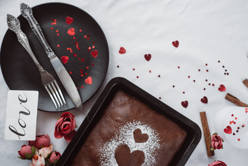 Baked homemade pie, with heart  with dishes on on white background. Healthy homemade whole grain pie. Valentines day   or mother's day 