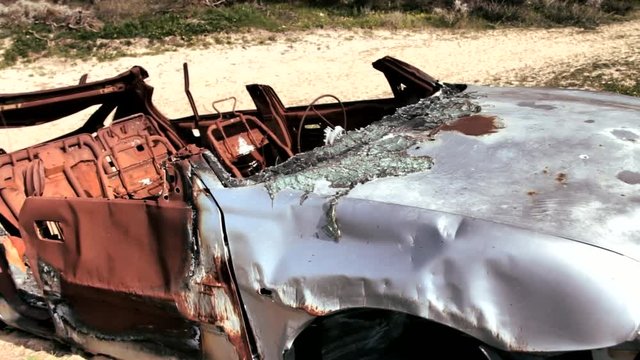 Burned car outside the road on the outskirts of Tel Aviv. Chronicle of crime