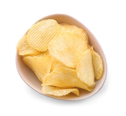 Bowl with tasty crispy potato chips on white background