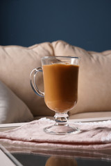 Glass cup of tasty frappe coffee on table