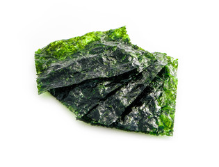 Roasted sheets of seaweed, a pile, isolated on white background. Asian healthy dry nori snack food.