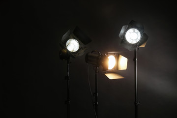 Professional lighting equipment on dark background