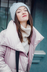 shopping, street fashion, style, people concept - model woman posing for photo outdoor. stylish...