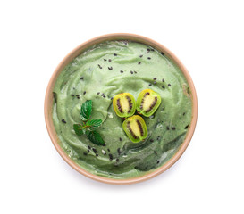 Bowl with tasty spirulina smoothie on white background