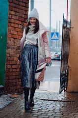 shopping, street fashion, style, people concept - model woman posing for photo outdoor. stylish...