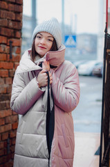 shopping, street fashion, style, people concept - model woman posing for photo outdoor. stylish...