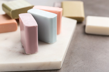 Fototapeta na wymiar Different soap bars on table