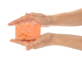 Female hands with soap bar on white background