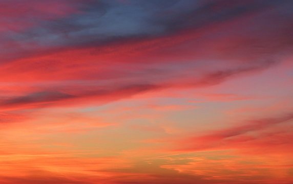 Fototapeta Beautiful fiery red sunset background in the sky, natural cloudscape