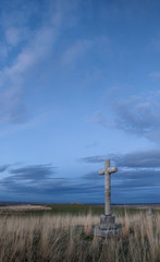 Crossings of stone representative of the Holy Week with background at dusk.