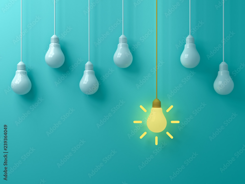 Poster think different concept one hanging yellow idea light bulb standing out from white unlit bulbs on bl