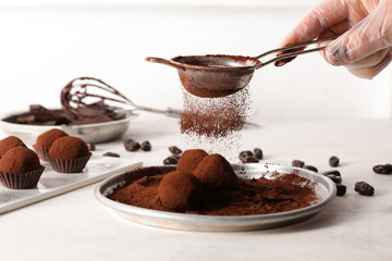 Woman preparing sweet truffles
