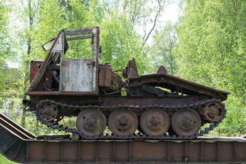 Old train and locomotive. Railroad tracks stretches and green grass and trees. Railway road environment background.