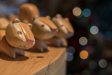 Three squirrel dolls on a table.