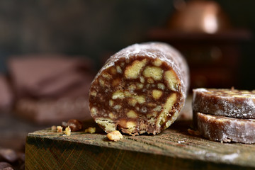 Homemade chocolate salami with cookies and nuts.