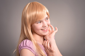 Portrait of a happy girl posing in studio