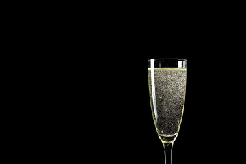 Glass of champagne on dark background