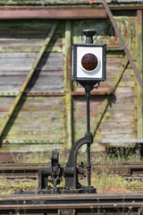 Railroad tracks stretches and green grass and trees. Railway road environment background..End of the rail.