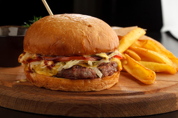 Big tasty burger and fries on the table