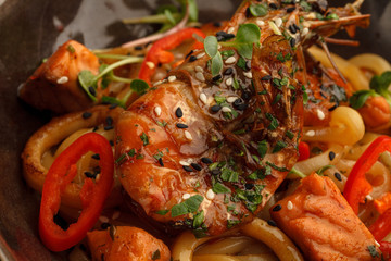 Stir fry with udon noodles, shrimps (prawns) and vegetables. Asian healthy food, meal
