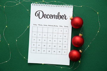 Calendar page of December on color background