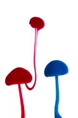 Abstract pattern falling into the water drop of red and blue ink