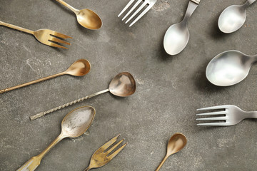 Set of cutlery on grey background