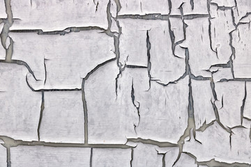 The old cracked paint on a wall surface.