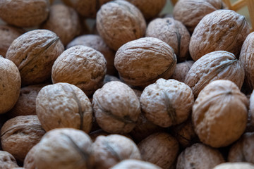 Many walnuts with a nutcracker