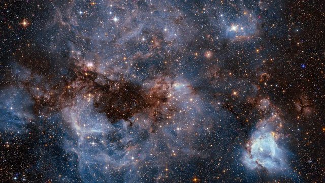 Traveling through star fields in space to a distant galaxy.