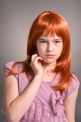 Close up portrait of cute girl with red hair posing