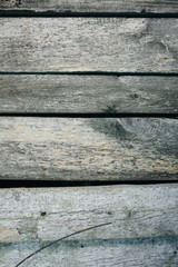 Old vintage wooden planks of the house. Grey wood texture background.