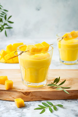 Mango Lassi, yogurt or smoothie with turmeric. Healthy probiotic Indian cold summer drink