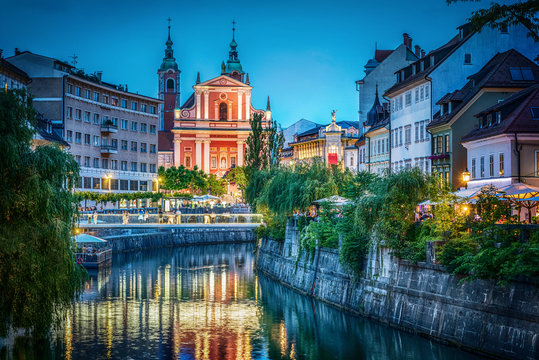 Evening view of the bridge and Ljubljanica river in the city center. Ljubljana, capital of Slovenia.