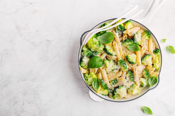 Tasty pasta penne with broccoli and cheese