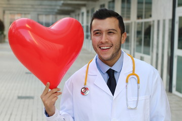 Cute ethnic doctor with a heart shaped balloon