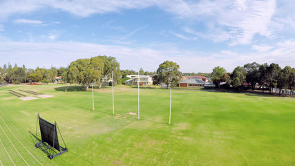 Drone aerial view of Australian public park and sports oval field, taken at Henley Beach.