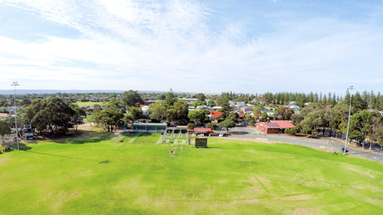 Drone aerial view of Australian public park and sports oval field, taken at Henley Beach.