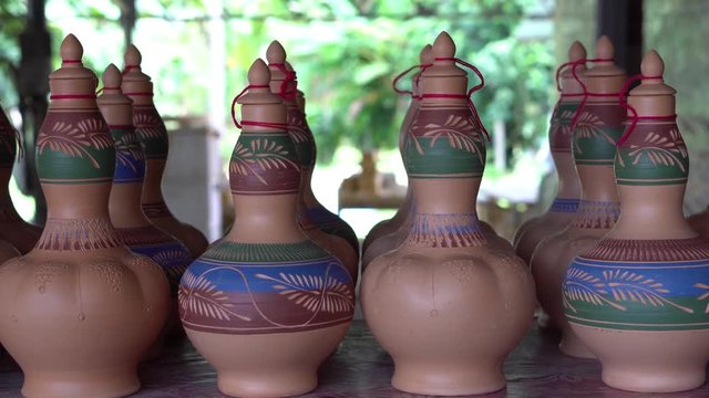 Handmade traditional craft known as 'labu sayong' normally used as gift or souvenir found in Perak,Malaysia. Clay pottery arts. Artistic clay container carving. UNGRADED.Panning Shot