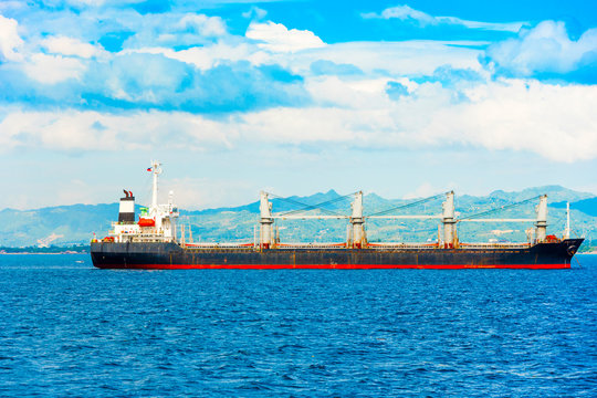 View of the cargo ship in the port of Cebu, Philippines. Copy space for text.