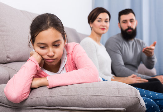 Parents lecturing daughter