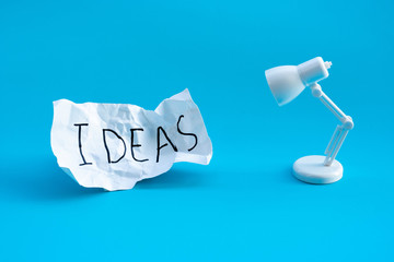 Idea and creativity concepts with lamp and text on paper crumpled.Business solution