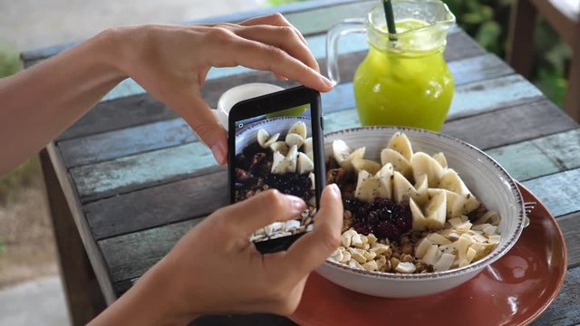 Closeup Food Blogger Taking Pictures Of Healthy Vegan Breakfast Using Smartphone