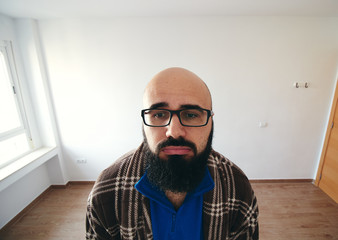 Obraz premium bored and sick man working at home with dressing gown